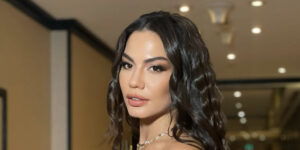 دمت اوزدمیر با پالتوی چرم مشکی در هفته مد لندن درخشید